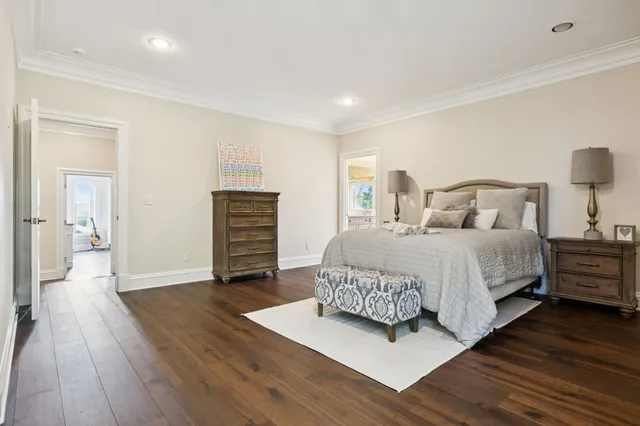a bathroom with a double vanity sink a mirror and a shower