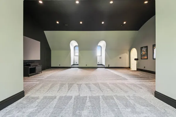 a bathroom with a granite countertop sink vanity and mirror