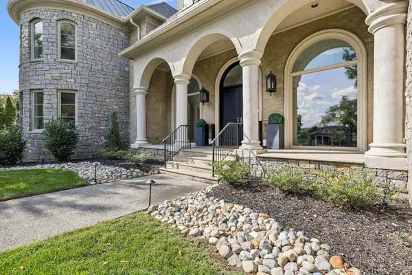 a front view of a house with garden