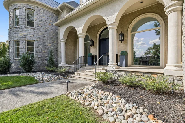 a front view of a house with garden