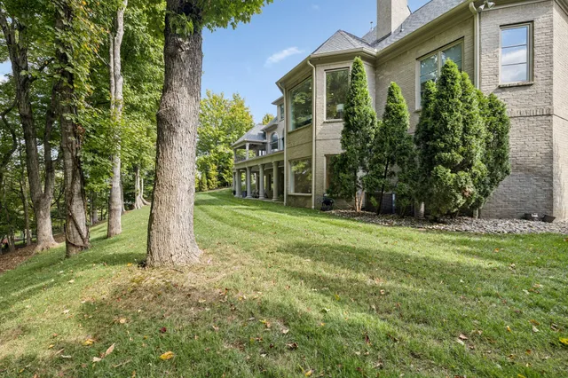 a view of house with backyard porch and sitting area
