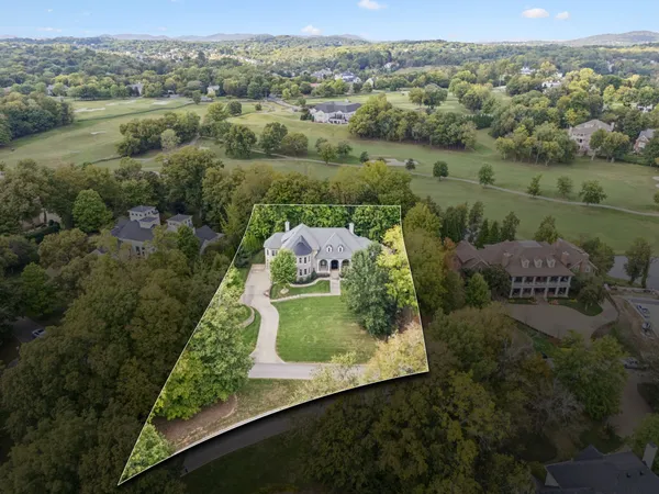 an aerial view of a house with outdoor space pool seating area and yard