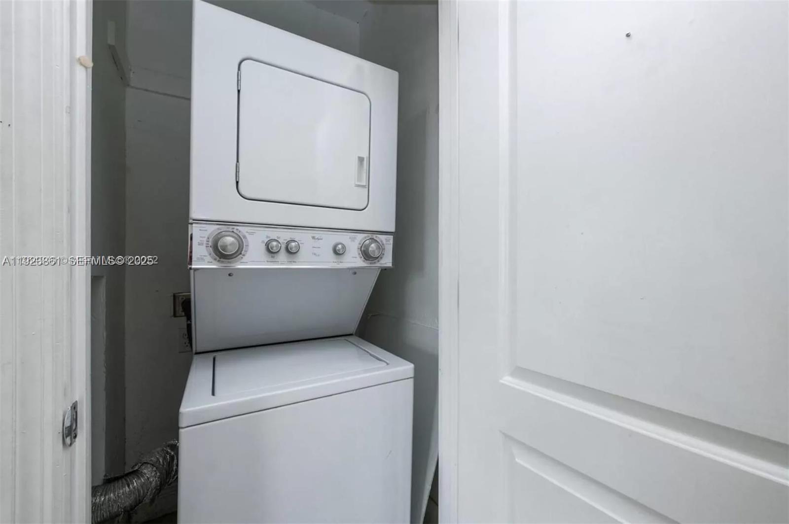 610 12th Street, Unit 5 Miami Beach, FL 33139 - Photo 7 of 8 a utility room with dryer and washer