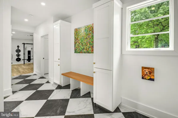a walk in closet with a rug