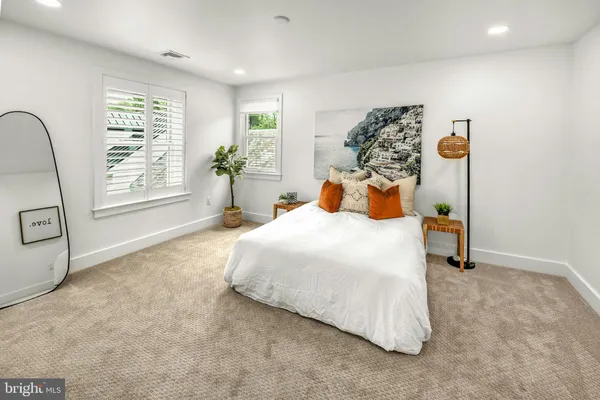 a bedroom with a bed and dresser
