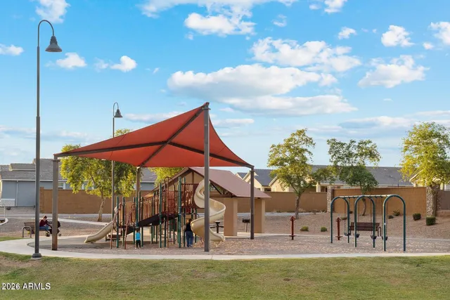 a view of a swimming pool with a table and chairs