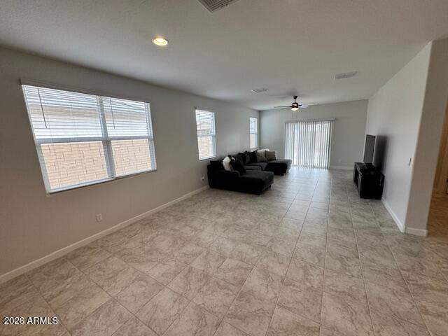 39995 West Agave Road Maricopa, AZ 85138 - Photo 5 of 26 a view of kitchen with refrigerator and window