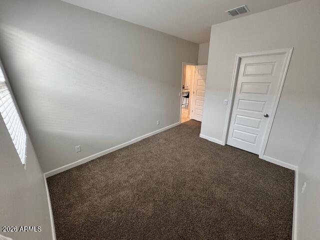 39995 West Agave Road Maricopa, AZ 85138 - Photo 9 of 26 an empty room with windows