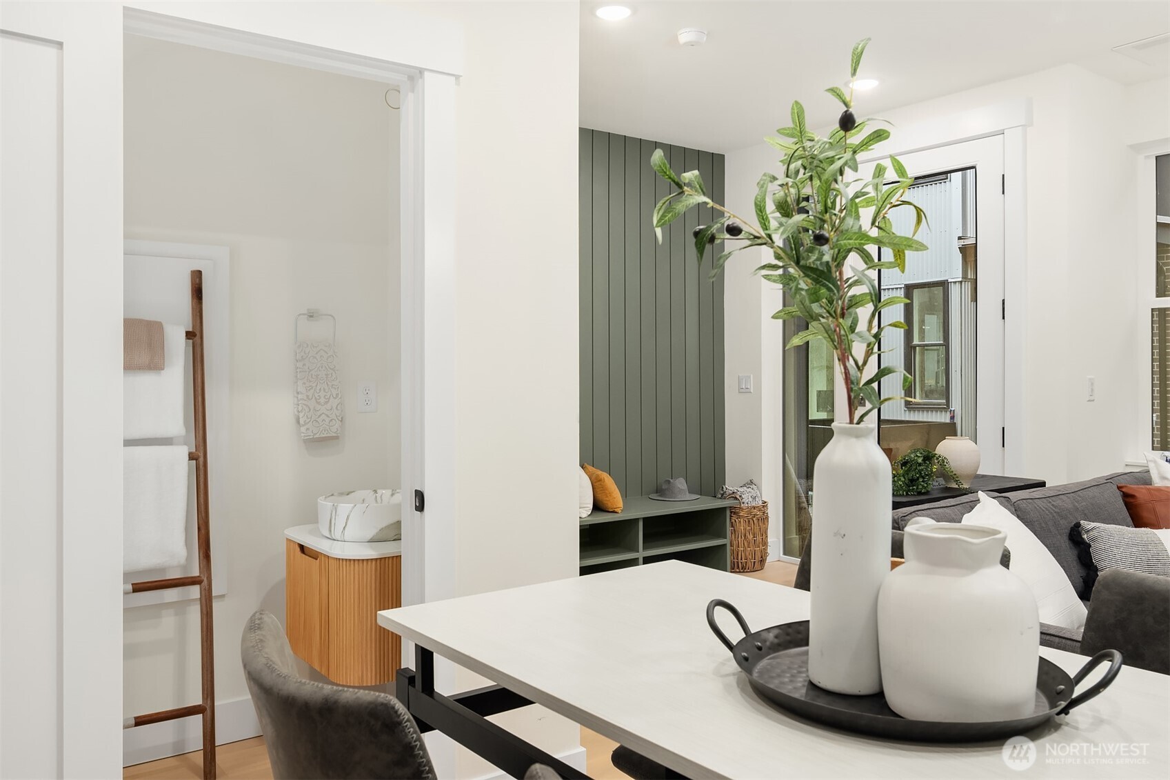 2018 Fairview Avenue East, Unit B Seattle, WA 98102 - Photo 12 of 17 a dining room with furniture and a potted plant