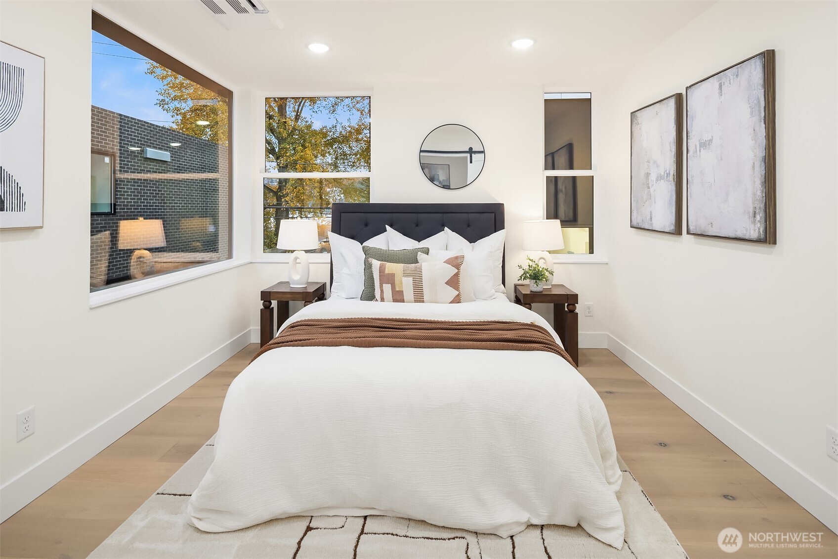 2018 Fairview Avenue East, Unit B Seattle, WA 98102 - Photo 14 of 17 a bed room with a bed mirror and a night stand