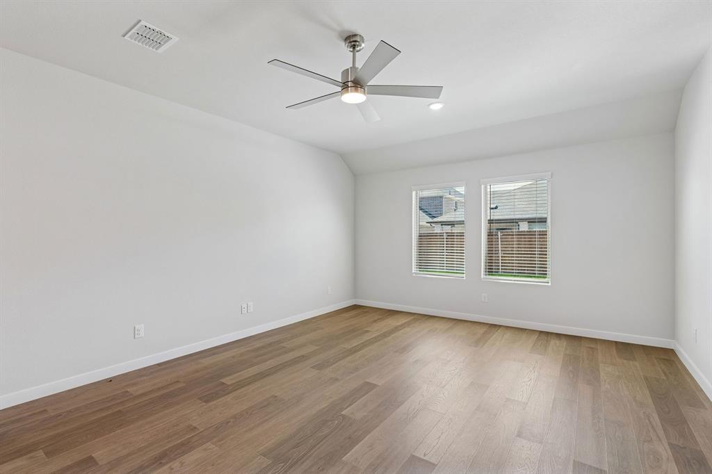 671 Sierra Ridge Lavon, TX 75166 - Photo 10 of 33 wooden floor in an empty room with a window