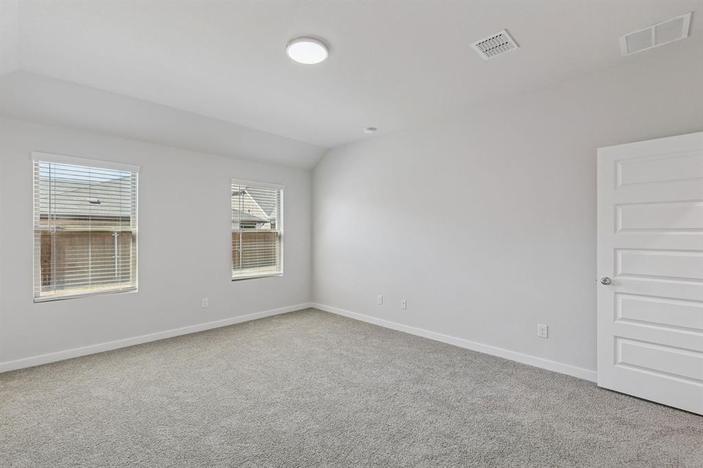671 Sierra Ridge Lavon, TX 75166 - Photo 19 of 33 an empty room with windows and closet