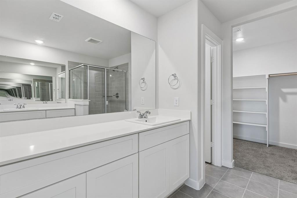 671 Sierra Ridge Lavon, TX 75166 - Photo 22 of 33 a bathroom with a sink and a mirror