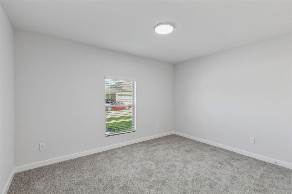 671 Sierra Ridge Lavon, TX 75166 - Photo 23 of 33 an empty room with windows