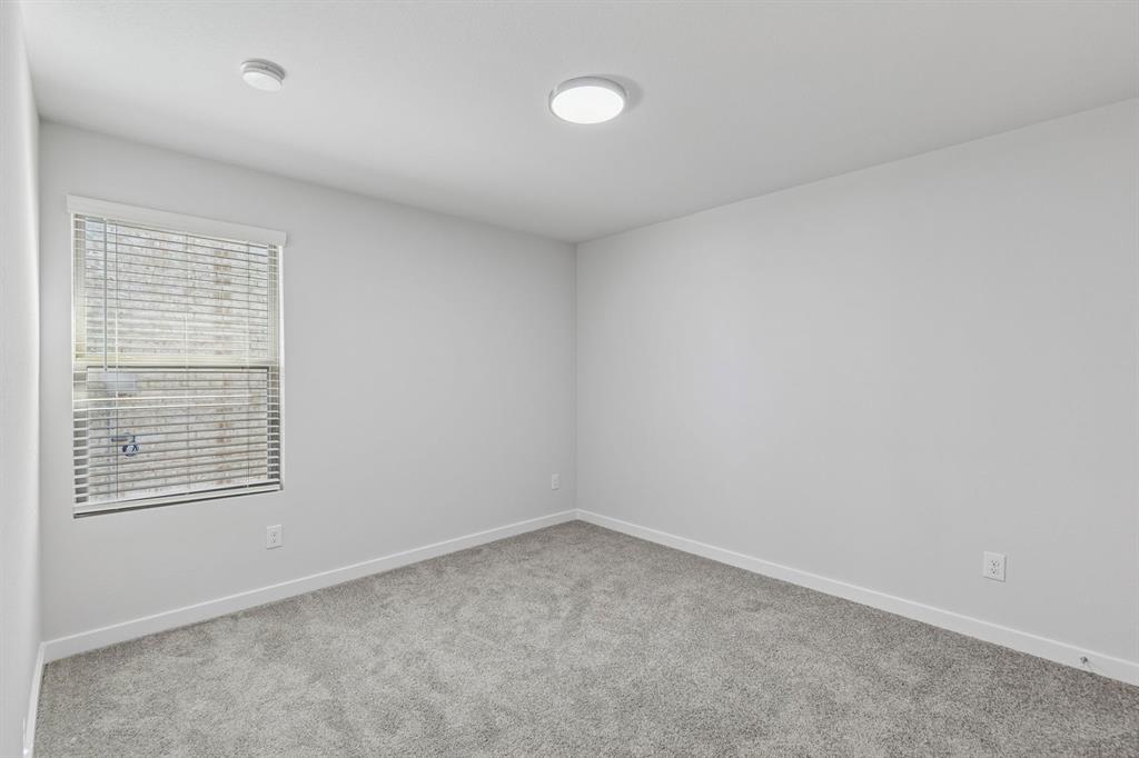 671 Sierra Ridge Lavon, TX 75166 - Photo 24 of 33 an empty room with a window