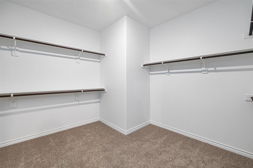 10305 Rambling Brks Lane Aubrey, TX 76227 - Photo 22 of 28 a view of an empty walk in closet