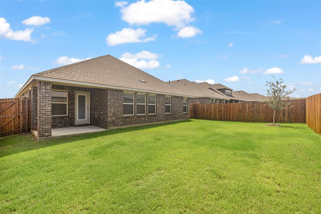 10305 Rambling Brks Lane Aubrey, TX 76227 - Photo 25 of 28 a view of a house with backyard and garden