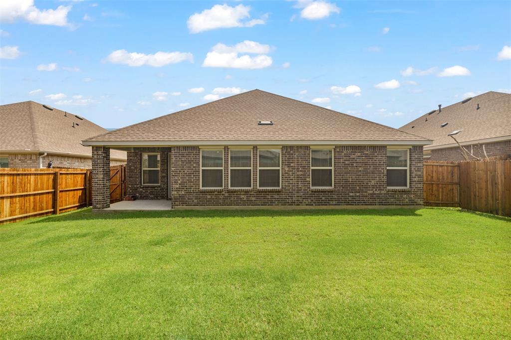 10305 Rambling Brks Lane Aubrey, TX 76227 - Photo 26 of 28 a front view of a house with a yard