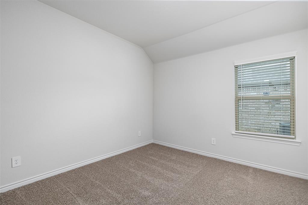 10305 Rambling Brks Lane Aubrey, TX 76227 - Photo 7 of 28 an empty room with a window