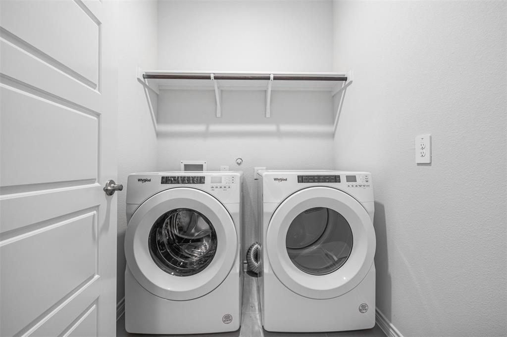 10305 Rambling Brks Lane Aubrey, TX 76227 - Photo 8 of 28 a utility room with dryer and washer