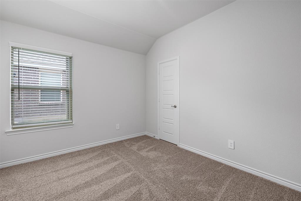 10305 Rambling Brks Lane Aubrey, TX 76227 - Photo 9 of 28 an empty room with a window