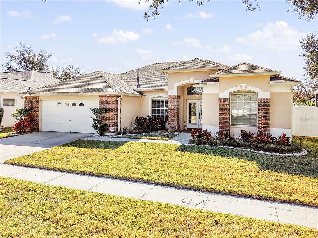 1818 South Ridge Drive Valrico, FL 33594 - Photo 1 of 1 a view of a house with swimming pool and a yard