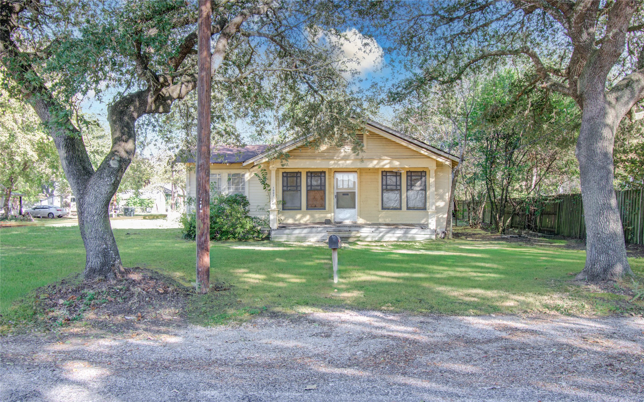 1003 Prairie Street Columbus, TX 78934 - Photo 1 of 29 a front view of a house with a yard