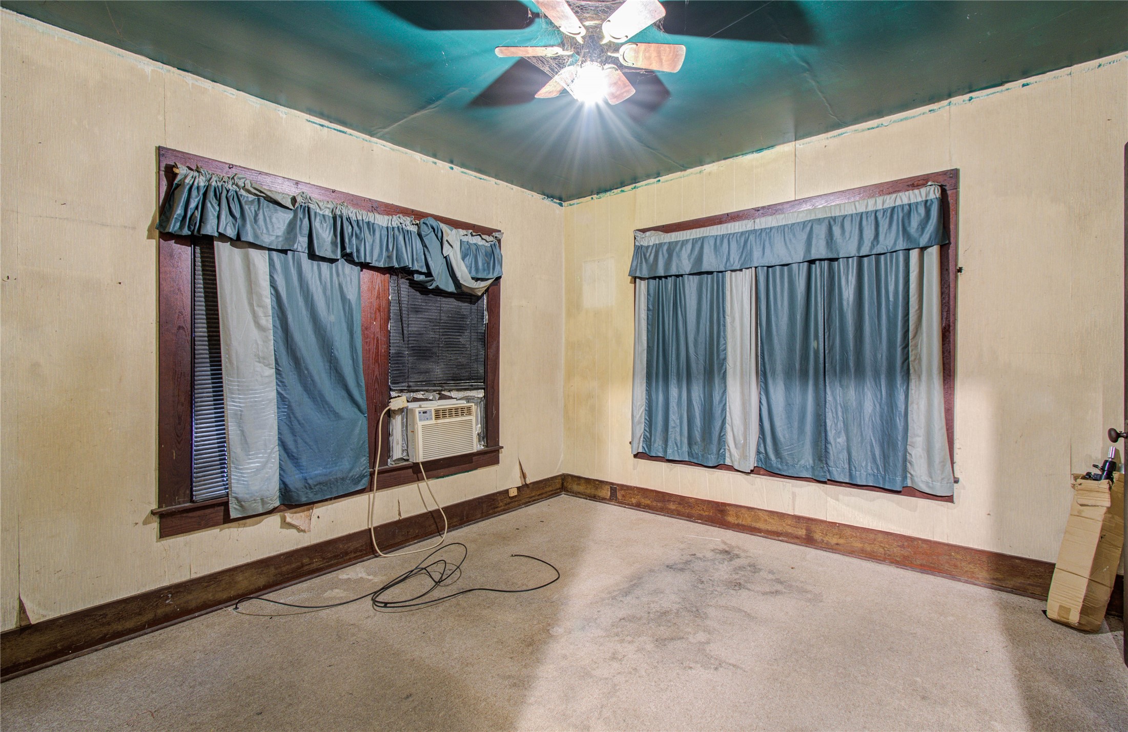 1003 Prairie Street Columbus, TX 78934 - Photo 19 of 29 a view of a room with stairs and a chandelier fan