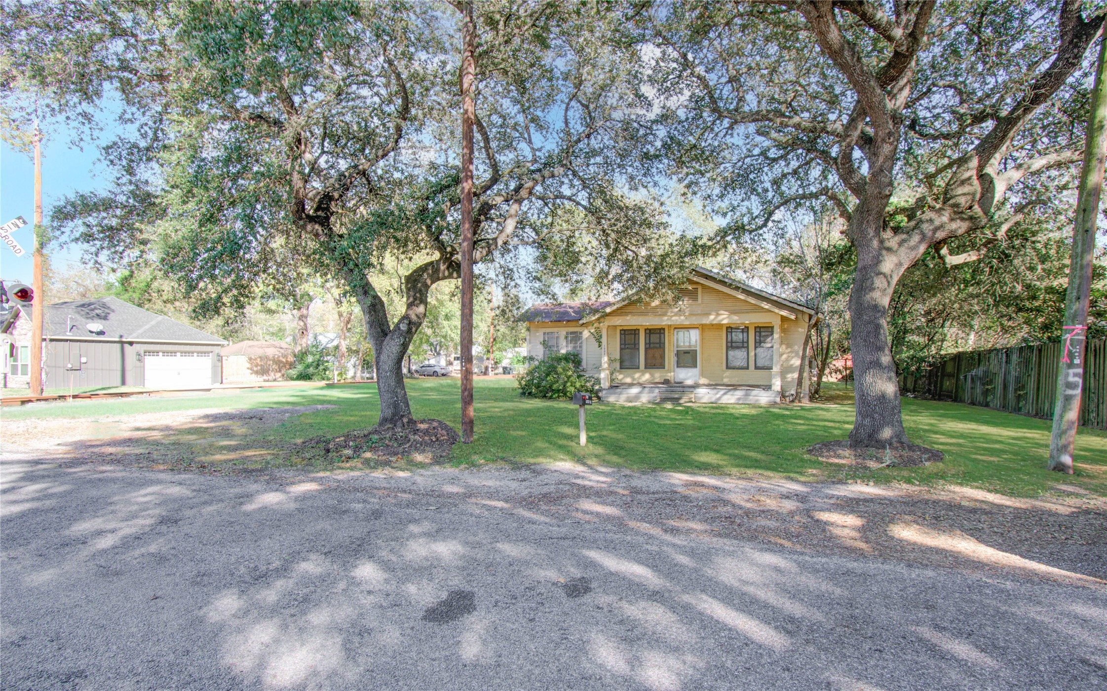 1003 Prairie Street Columbus, TX 78934 - Photo 2 of 29 a view of a house with yard and tree s