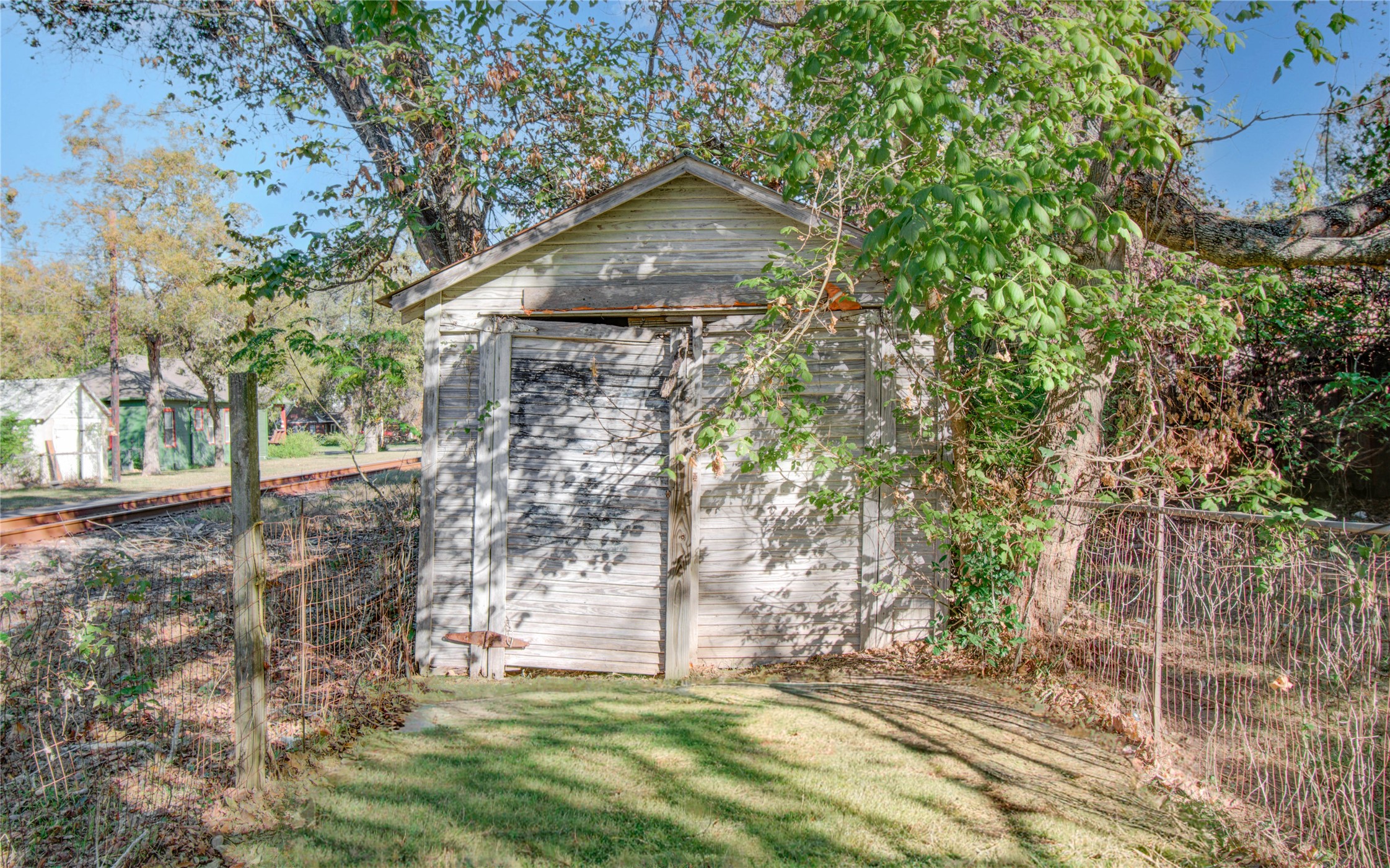 1003 Prairie Street Columbus, TX 78934 - Photo 22 of 29 a front view of a house with a garden