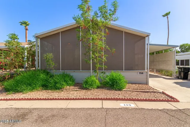 a front view of a house having yard
