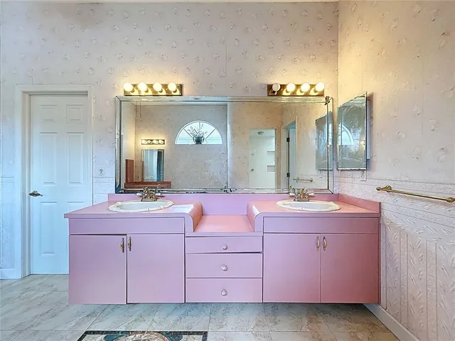 a bathroom with a tub and a window