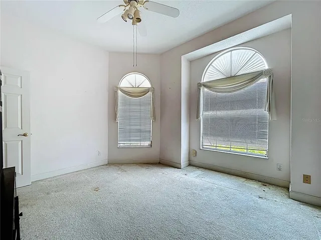 a kitchen with stainless steel appliances granite countertop a stove top oven a sink a microwave and a refrigerator