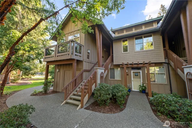 a front view of a house with a street