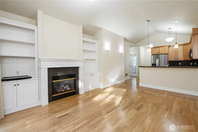 a view of a kitchen with a stove cabinets and a fireplace