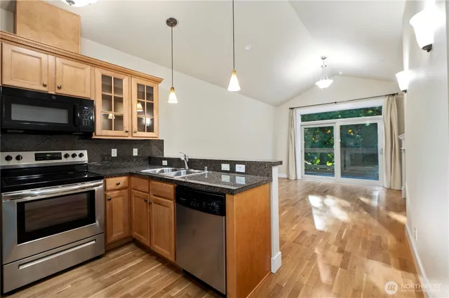 a kitchen with a stove and a sink