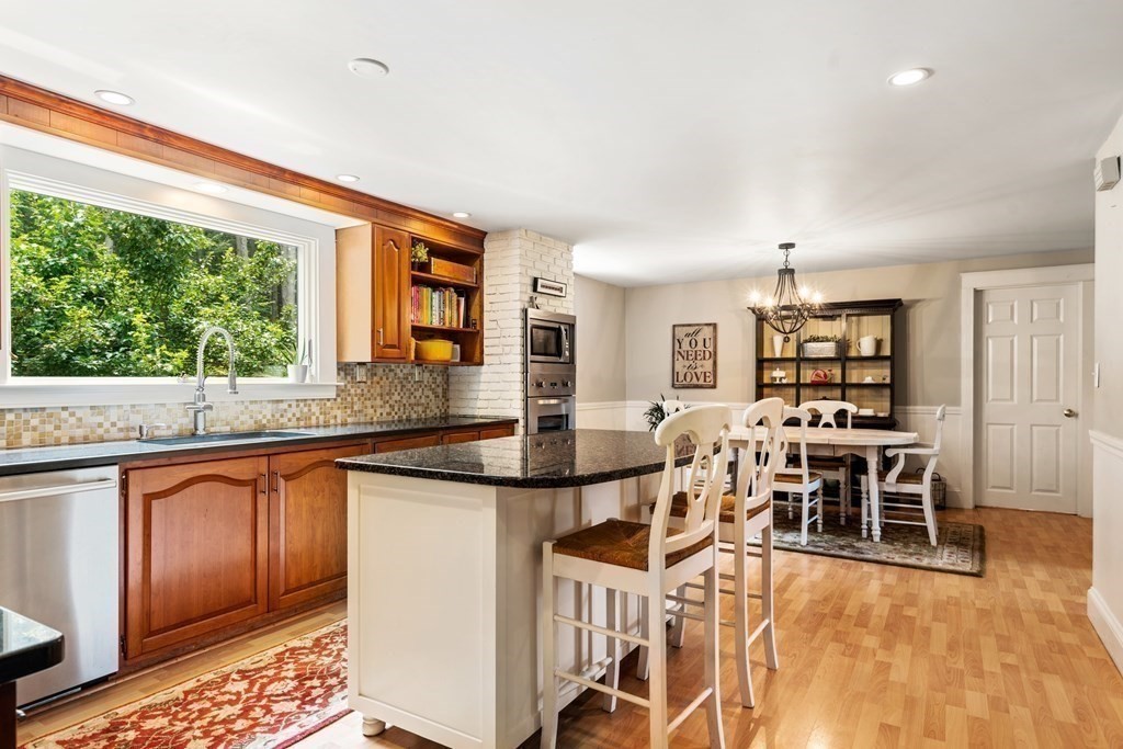 114 Still River Road Harvard, MA 01451 - Photo 16 of 42 a dining hall with stainless steel appliances granite countertop a stove and a sink