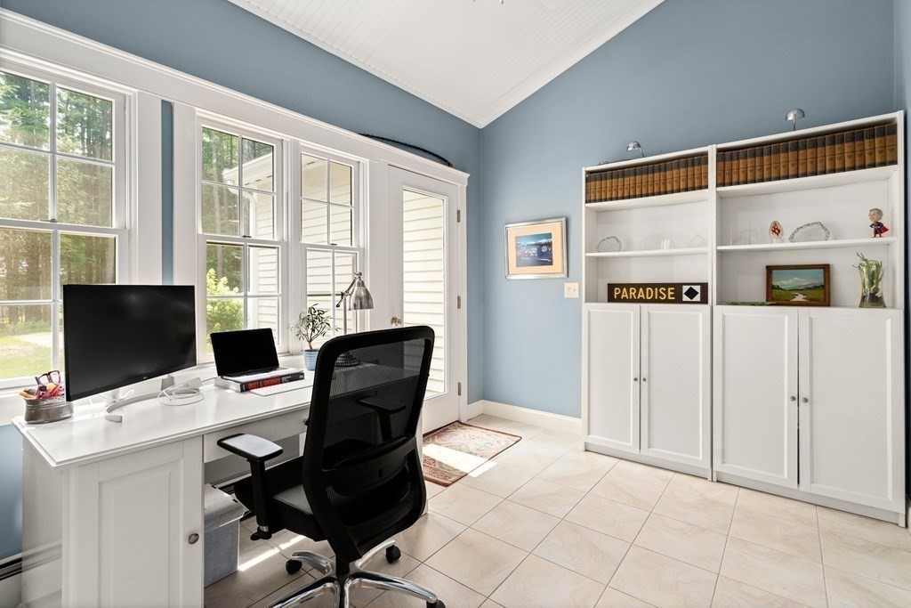 114 Still River Road Harvard, MA 01451 - Photo 20 of 42 a view of a workspace with furniture and a window