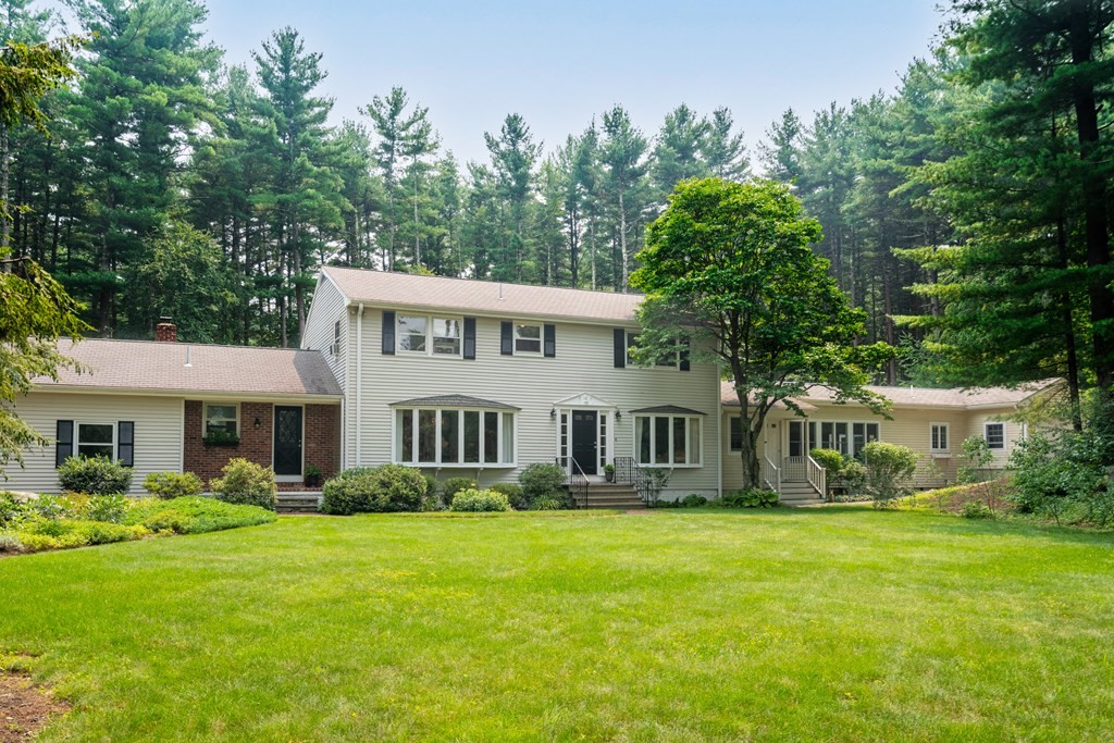114 Still River Road Harvard, MA 01451 - Photo 2 of 42 a front view of a house with garden and trees