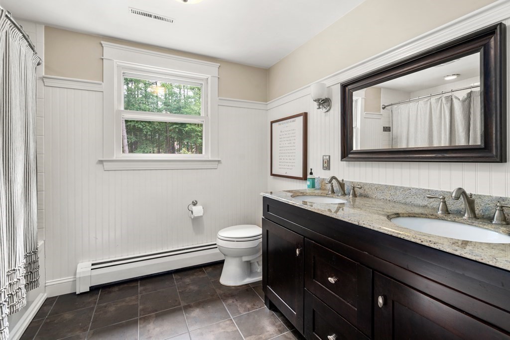 114 Still River Road Harvard, MA 01451 - Photo 24 of 42 a bathroom with a toilet sink double vanity and mirror