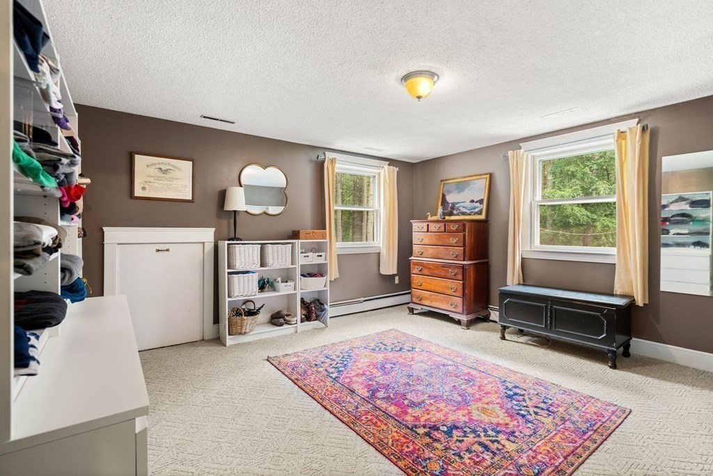 114 Still River Road Harvard, MA 01451 - Photo 25 of 42 a living room with furniture and a flat screen tv