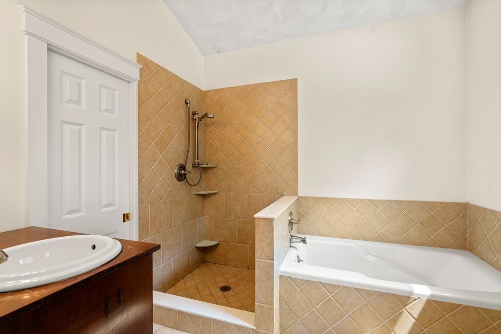 114 Still River Road Harvard, MA 01451 - Photo 37 of 42 a bathroom with a tub a sink and a shower
