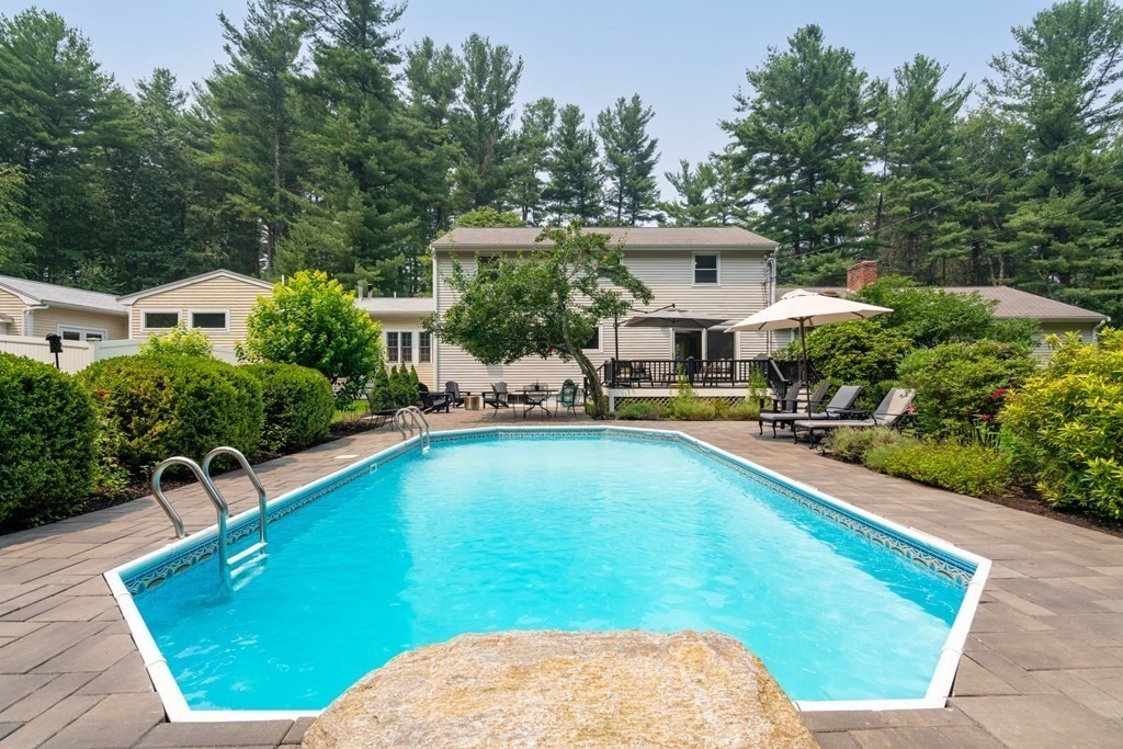 114 Still River Road Harvard, MA 01451 - Photo 4 of 42 a view of a swimming pool with lawn chairs and plants
