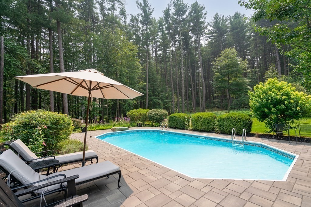114 Still River Road Harvard, MA 01451 - Photo 6 of 42 a view of pool with table and chairs under an umbrella