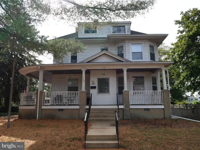 a front view of a house with a porch