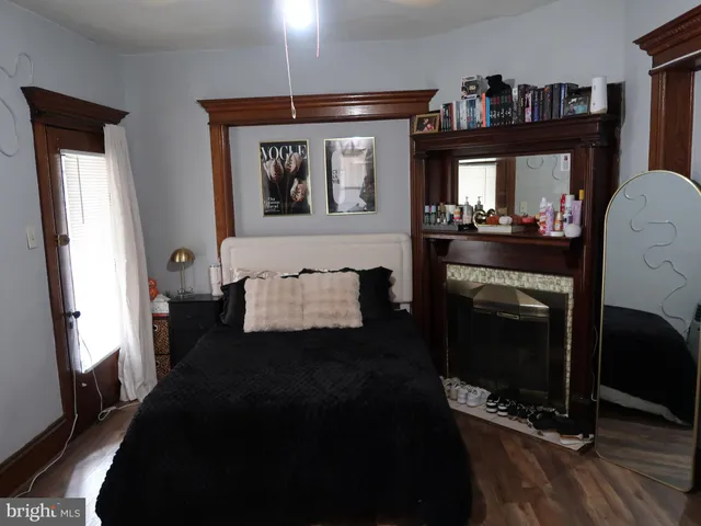 a bed room with a bed window and a television