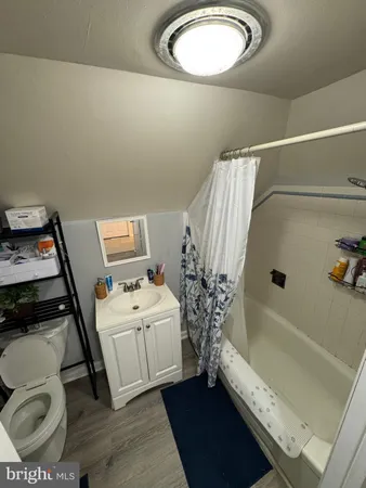 a living room with a couch and gym equipment