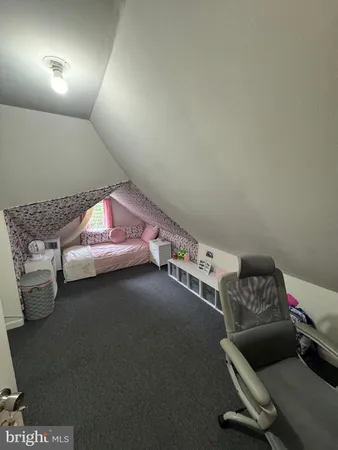 a bedroom with bed and window