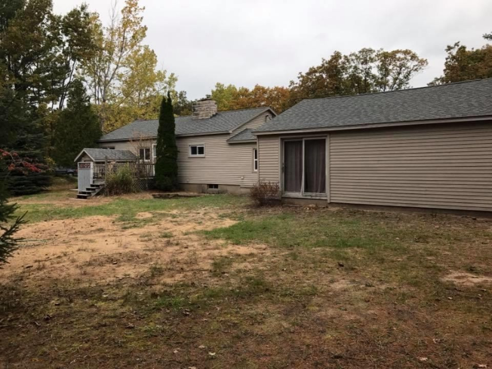 1253 Red Apple Road Manistee, MI 49660 - Photo 3 of 25 rear