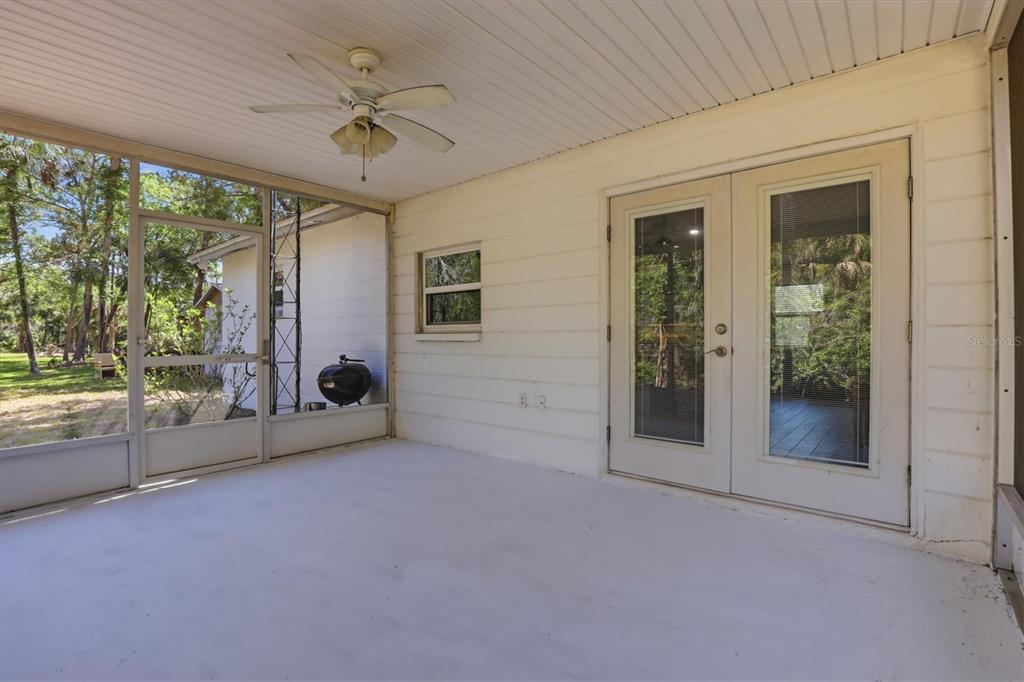 6244 Colony Circle Weeki Wachee, FL 34607 - Photo 57 of 60 an empty room with windows and ceiling fan